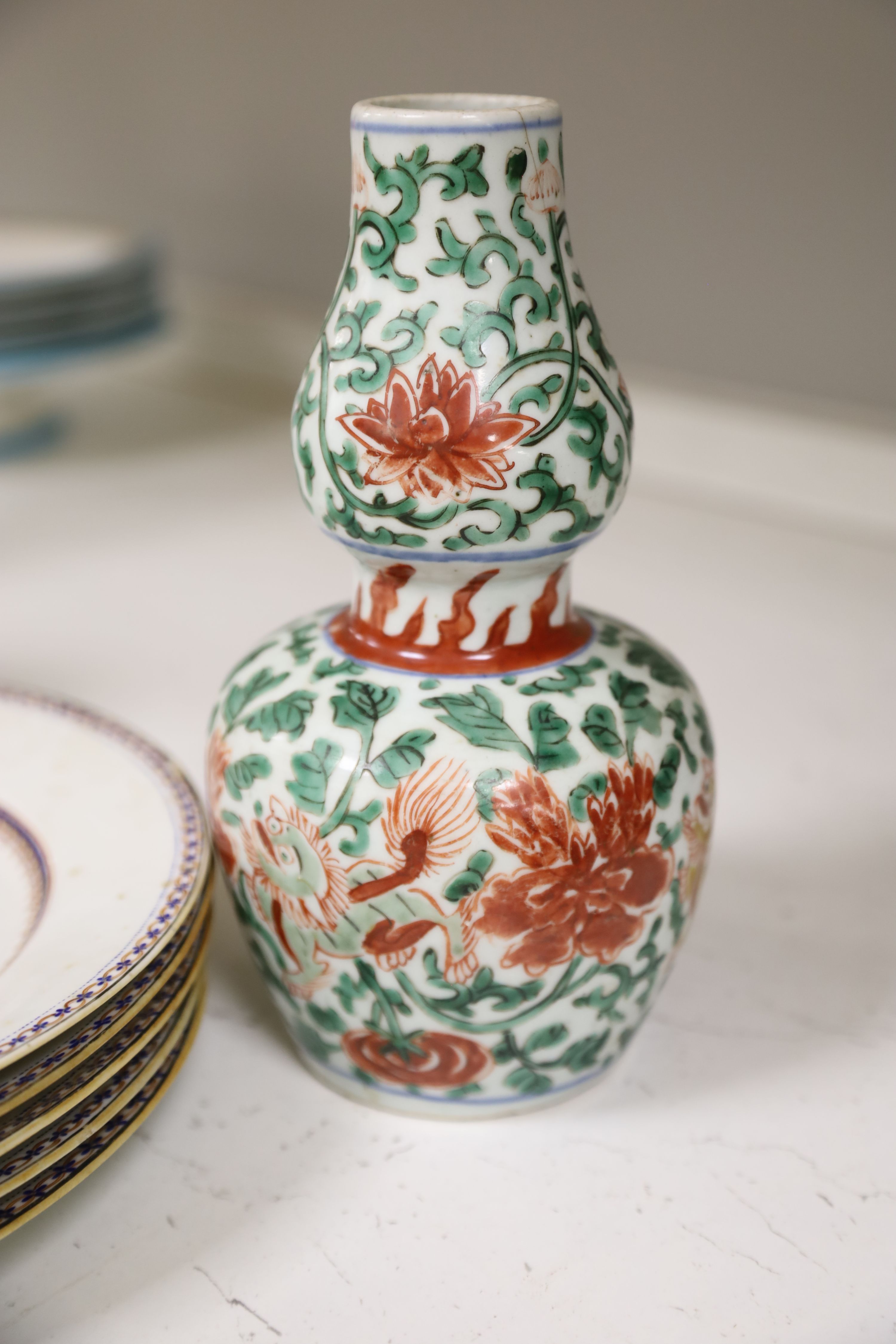 A collection of mixed Asian ceramics, including various Chinese blue and white export plates,